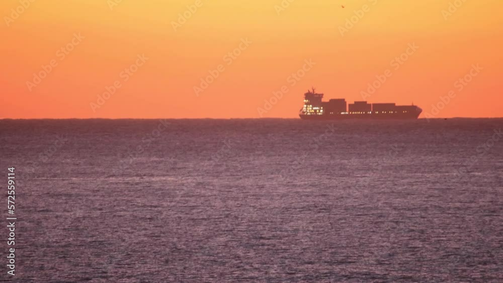 Beautiful evening sunset with a sailing ship in the Atlantic Ocean on the coast of Portugal. Beautiful evening sunset with a sailing ship in the Atlantic Ocean on the coast of Portugal.