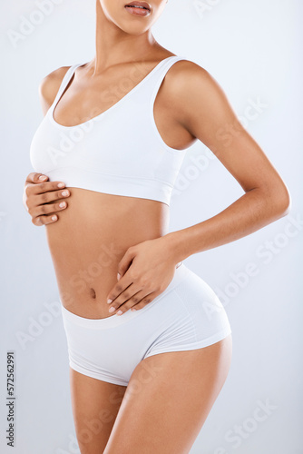 Fototapeta Naklejka Na Ścianę i Meble -  Body care, beauty and black woman with fitness, health and slim diet aesthetic with hair removal. Isolated, white background and studio with model after cellulite, liposuction and cosmetic treatment