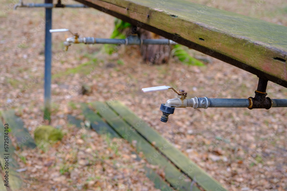 Sanitary unit. Water taps for washing hands outdoors in the camping area. Shared sanitary unit Sanitary unit. Water taps for washing hands outdoors in the camping area. Shared sanitary unit