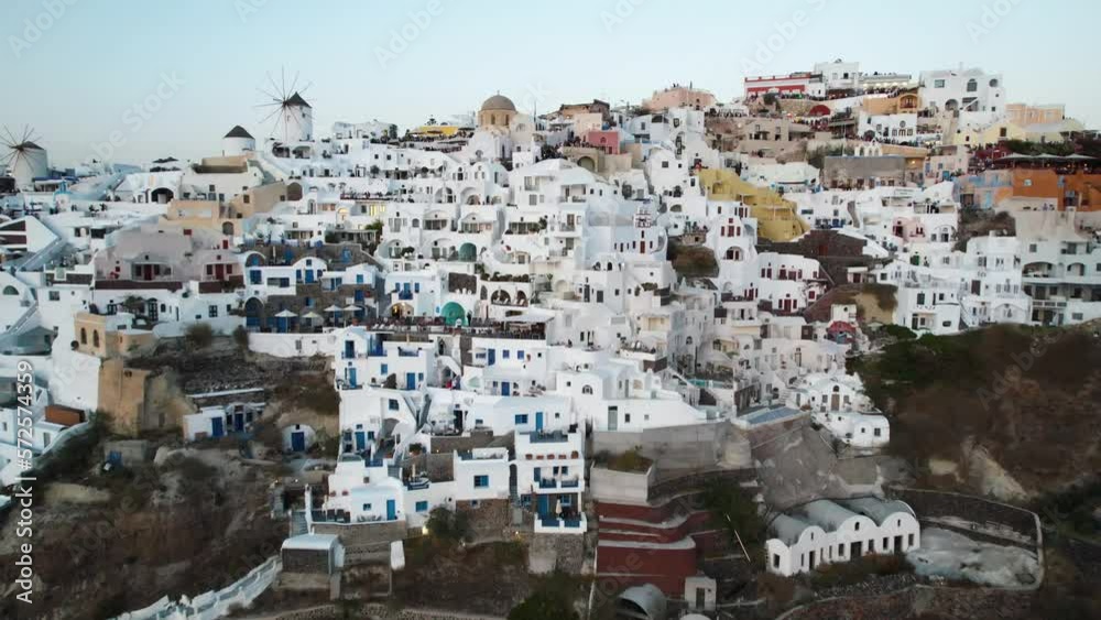 Aerial View of Santorini, Greece. Traditional White Buildings and Summer Resorts Drone Shot