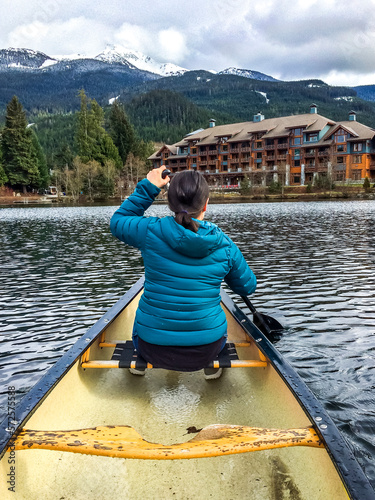 Woman canoeing on Nita Lake, Whistler, British Columbia, Canada photo