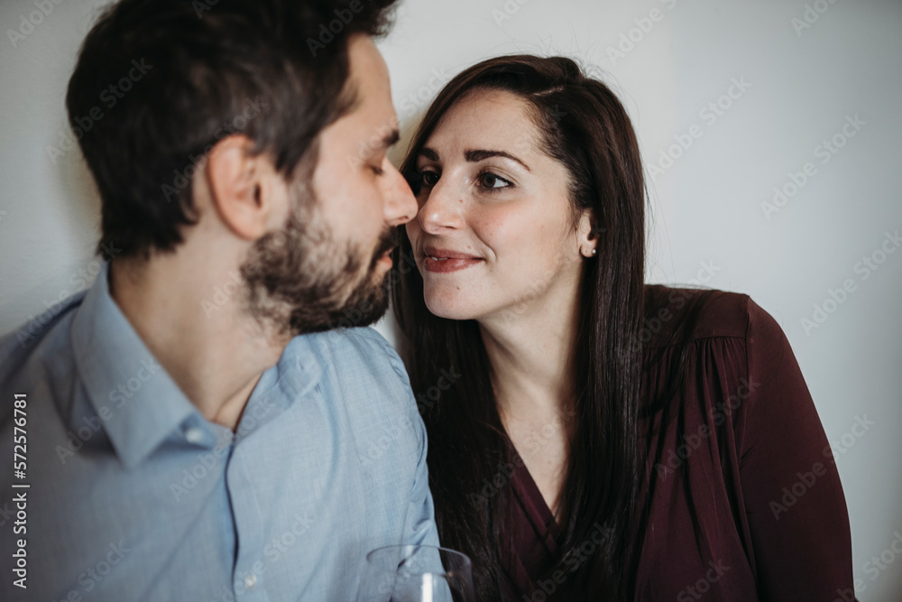 Young couple drinking red wine in a relaxing moment Young couple drinking red wine in a relaxing moment