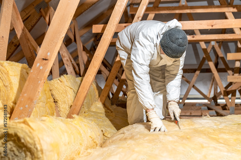 thermal insulation of roof spaces with glass wool - obrazy, fototapety, plakaty 