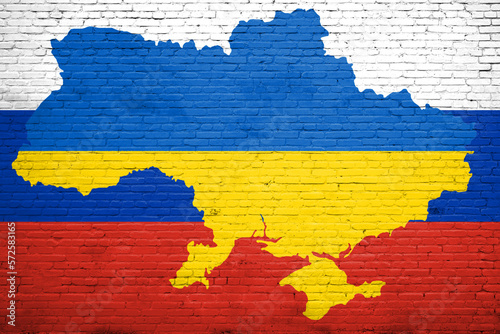 Flag of Ukraine and Russia painted on a brick wall. Relationship between Ukraine and Russia