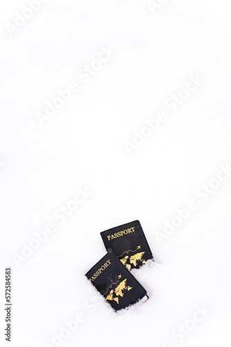 Two passport on beautiful snowflakes falling on the ground. People enjoy outdoor lifestyle travel Japan on winter holiday vacation and international airplane transportation concept.