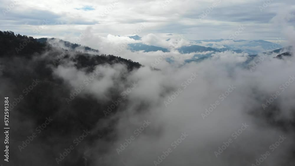 Drone Video flying over sea of clouds and mountains , deep in pine wild forest Mount Gramos Northern Greece Drone Video flying over sea of clouds and mountains , deep in pine wild forest Mount Gramos Northern Greece