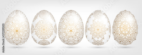 Hand drawn Easter collection of many white ornamental eggs with golden patterns, mandala, flowers, leaves. Abstract vector floral set illustration at Easter greeting card, invitation, web design