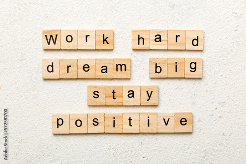 Work hard dream big stay positive word written on wood block. Work hard dream big stay positive text on cement table for your desing, Top view concept