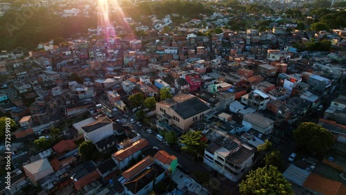 Aerial view of a protestant church in middle of a favela, sunset in Sao Paulo, Brazil photo
