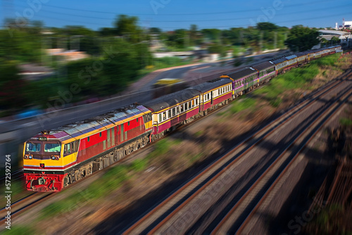 Passenger train by diesel locomotive on the railway.