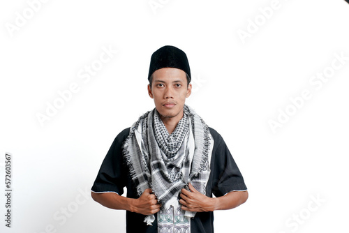 Religious muslim asian man wearing turban, muslim dress and cap. Isolated on white background. © Nasrul Ma Arif