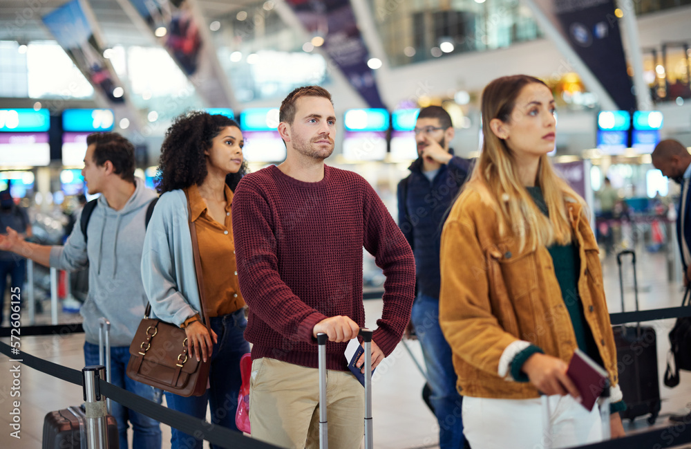 Travel, queue and wait with man in airport for vacation, international trip and tourism. Holiday, luggage and customs with passenger in line for airline ticket, departure and flight transportation