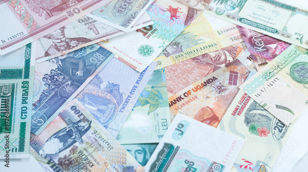 Various currencies. Banknotes, money from different countries. Diversification of the investment portfolio. Investing in financial instruments, saving. Inflation, exchange rates.