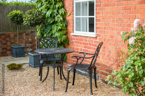 Garden furniture on gravel patio area  UK garden