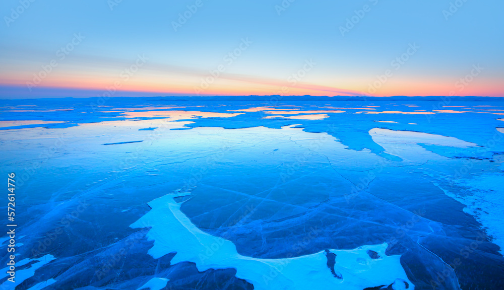 Frozen lake Baikal in winter season at amazing sunset, Olkhon island in Siberia, Russia