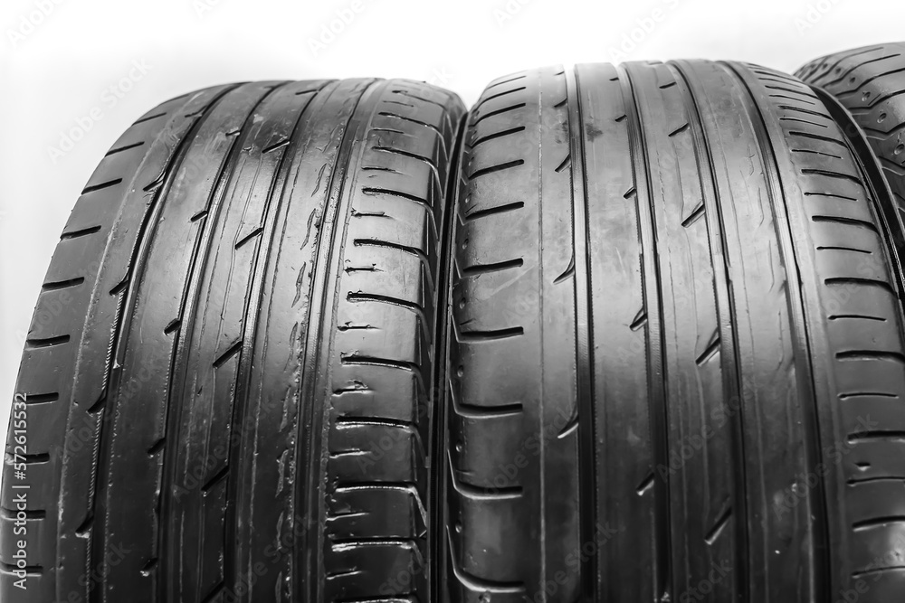 Used Car black summer tires close-up Used Car black summer tires close-up