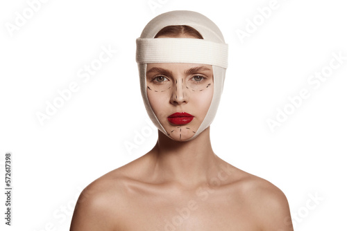 Fotografie Female face bandaged with medical bandages human emotions