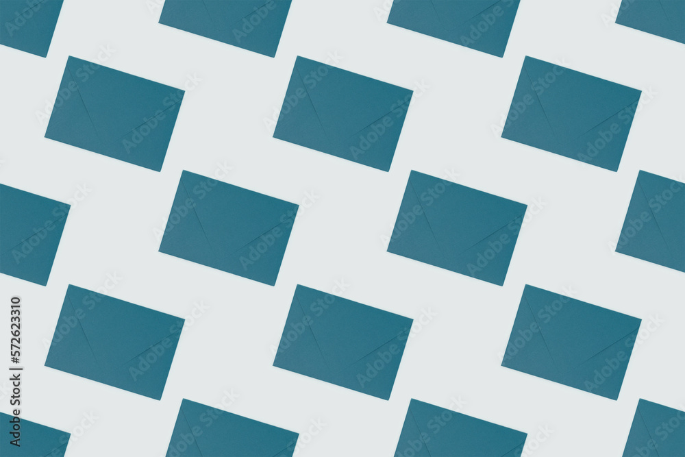 Repetitive pattern made of green envelopes on a blue background. Repetitive pattern made of green envelopes on a blue background.