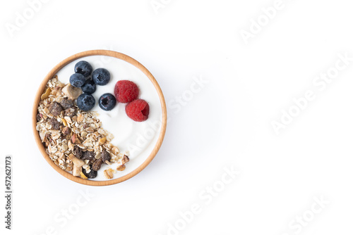 Yogurt with berries and muesli for breakfast in bowl isolated on white background. Top view