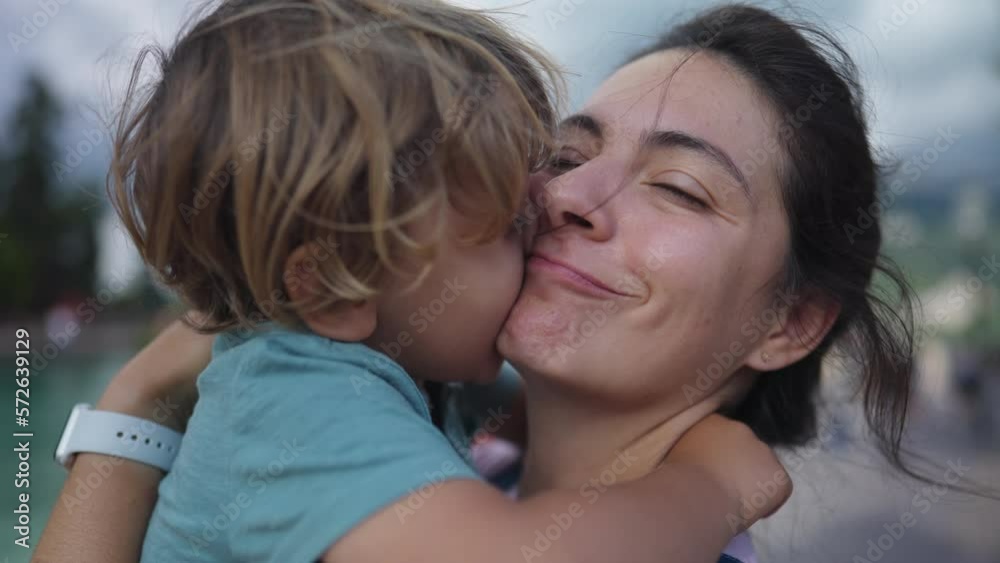 Cute mother and child bonding moment. Loving caring parent and child embrace. Lifestyle parenting hug and love outdoors Cute mother and child bonding moment. Loving caring parent and child embrace. Lifestyle parenting hug and love outdoors