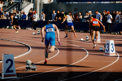 start running men relay race in athletics competition