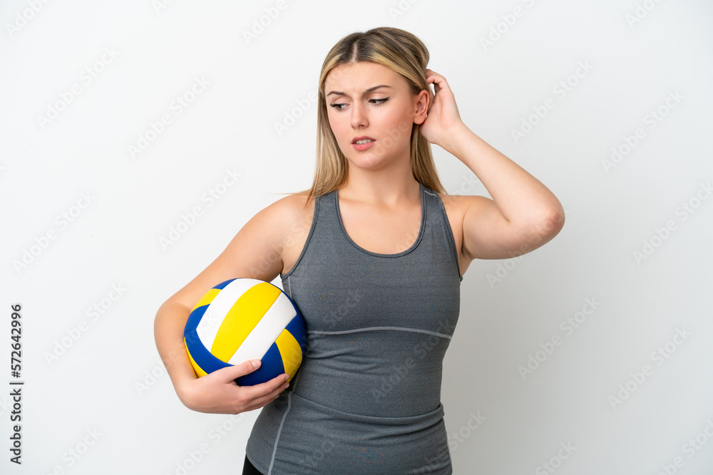Young caucasian woman playing volleyball isolated on white background having doubts