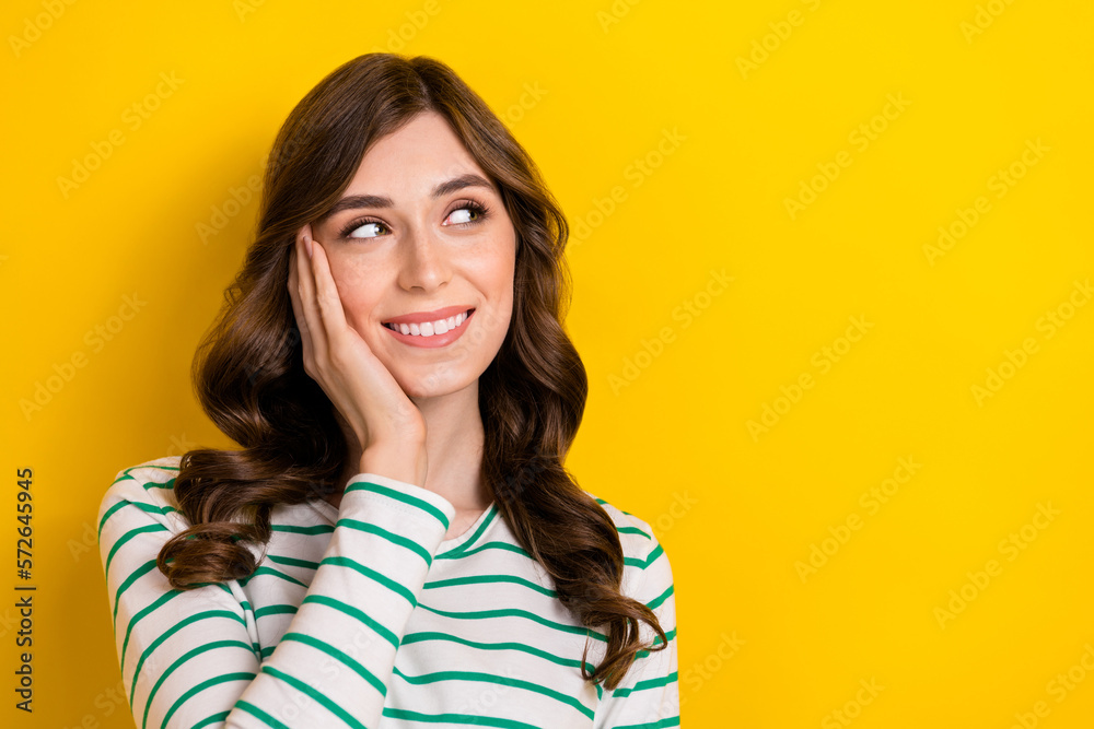 Portrait of dreamy lovely positive attractive woman wear striped white shirt touch cheek smiling look mockup ad isolated on yellow color background Portrait of dreamy lovely positive attractive woman wear striped white shirt touch cheek smiling look mockup ad isolated on yellow color background