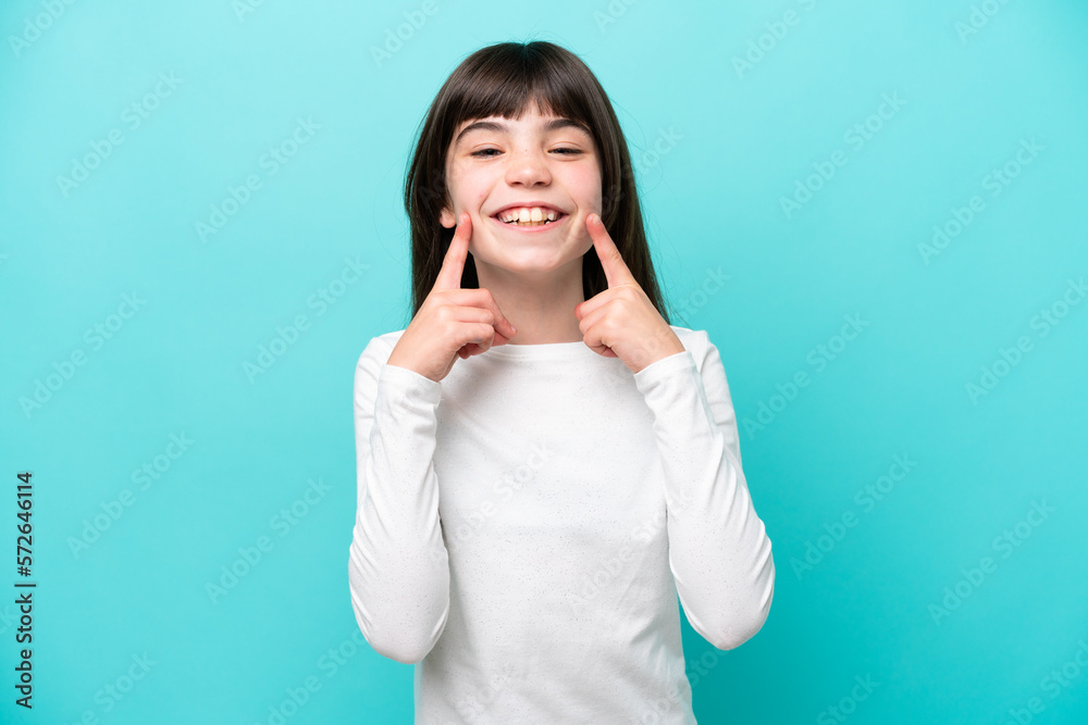 Little caucasian girl isolated on blue background smiling with a happy and pleasant expression Little caucasian girl isolated on blue background smiling with a happy and pleasant expression