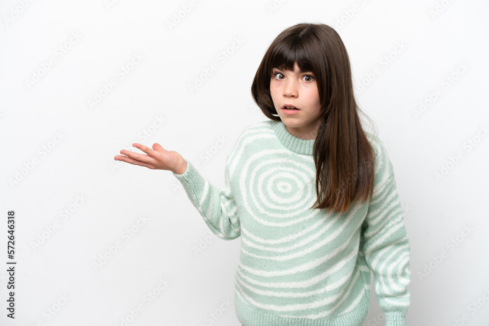 Little caucasian girl isolated on white background making doubts gesture Little caucasian girl isolated on white background making doubts gesture