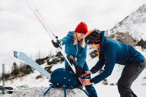 Couple getting ready for ski touring adventure in the Alps photo