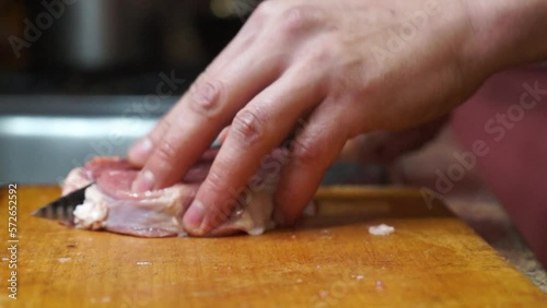 Rural cuisine. Cooking pork in a home country kitchen. Cut tenderloin for steak.