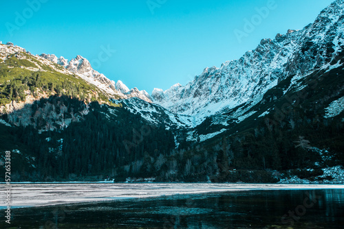 Awesome Sunny Day. Hiking Trail near famous Lake Popradske Pleso. Incredible mountains Scenery  Popular travel destination. High Tatras. Slovakia. Wonderful Nature Landscape in winter months.
