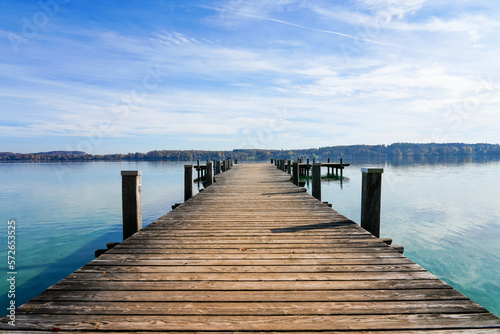 Idyllic landscape in the morning with a pier on the lake.  © Elly Miller
