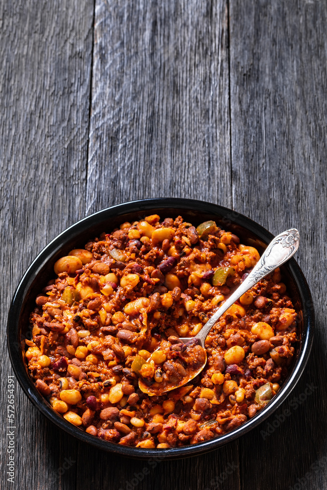 Fototapeta premium Beans and Sausage bake in baking dish, top view