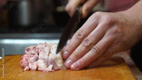 Rural cuisine. Cooking pork in a home country kitchen. Cut tenderloin for steak.