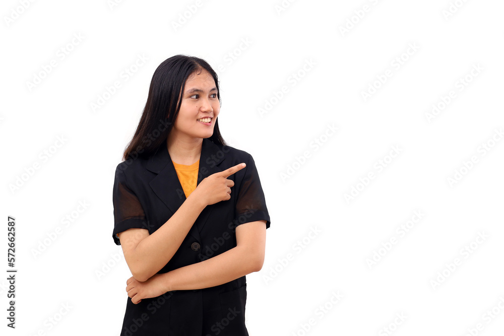 Happy young asian business woman standing while pointing at blank space beside her. Isolated Happy young asian business woman standing while pointing at blank space beside her. Isolated