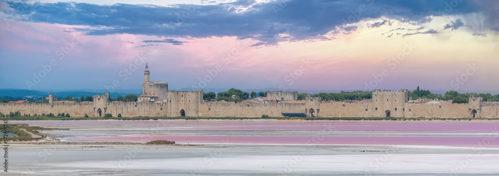     Aigues-Mortes, ancient city in France, Salins du Midi, panorama with pink lake 
 - obrazy, fototapety, plakaty 