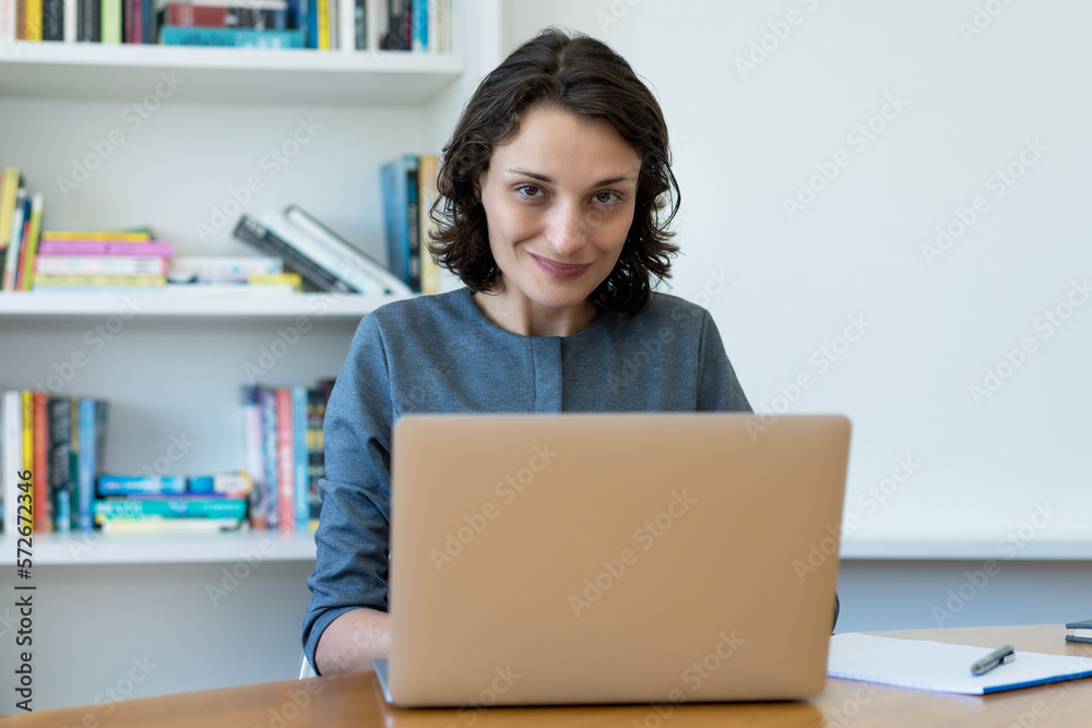 Caucaisan mature businesswoman working at computer Caucaisan mature businesswoman working at computer