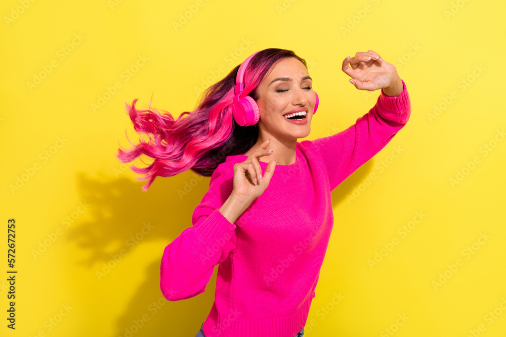 Photo of adorable dreamy lady wear vivid sweater listening songs dancing closed eyes isolated yellow color background Photo of adorable dreamy lady wear vivid sweater listening songs dancing closed eyes isolated yellow color background