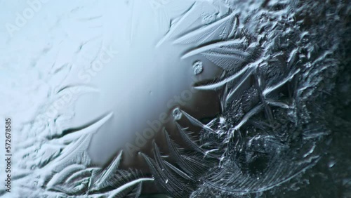 Ice Age. Crystallization of water on a smooth glass surface photo