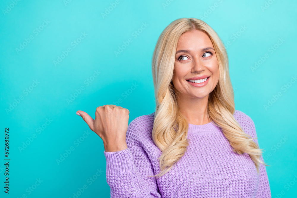 Portrait of pretty cheerful lady look direct finger empty space proposition ad isolated on teal color background Portrait of pretty cheerful lady look direct finger empty space proposition ad isolated on teal color background