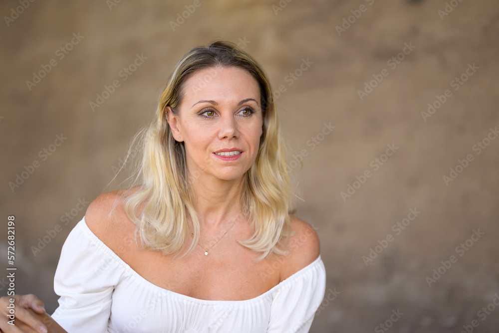 Sideways portrait of a middle-aged blonde woman Sideways portrait of a middle-aged blonde woman