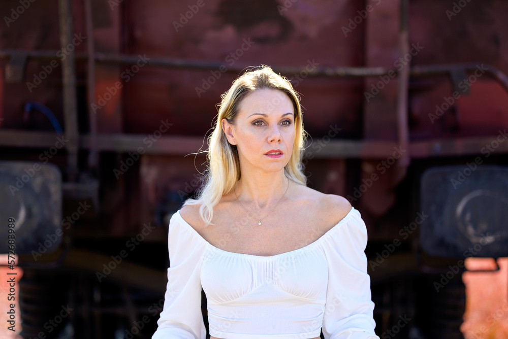 Fototapeta premium Sensual middle aged woman wearing a white blouse