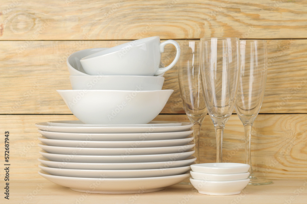 Tableware on a wooden background. Clean tableware. Tableware on a wooden background. Clean tableware.