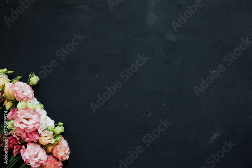 beautiful eustoma flowers of different colors on a black background