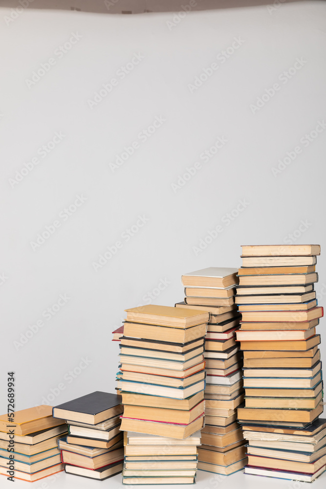 large stacks of books in the library on a white background knowledge science literature large stacks of books in the library on a white background knowledge science literature