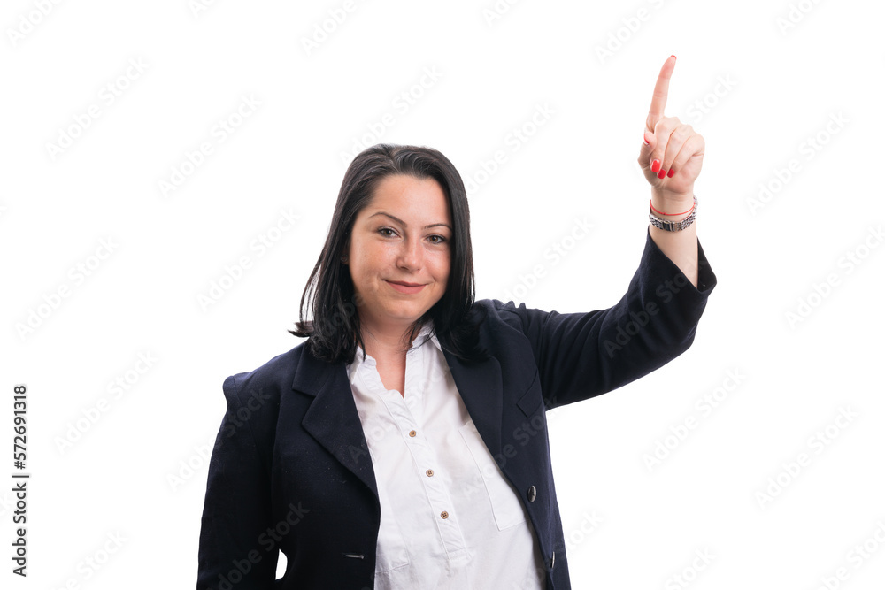 Friendly female entrepreneur pointing index finger at copyspace Friendly female entrepreneur pointing index finger at copyspace