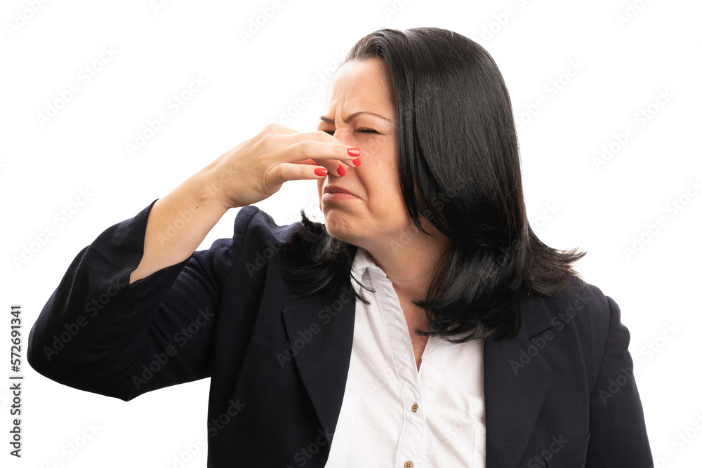 Close-up of businesswoman holding nose as bad smell concept Close-up of businesswoman holding nose as bad smell concept