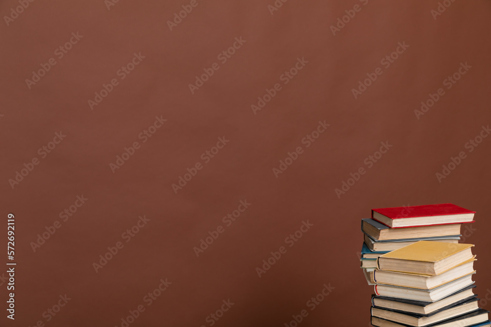 reading science knowledge many books stacked in a library on a brown background reading science knowledge many books stacked in a library on a brown background