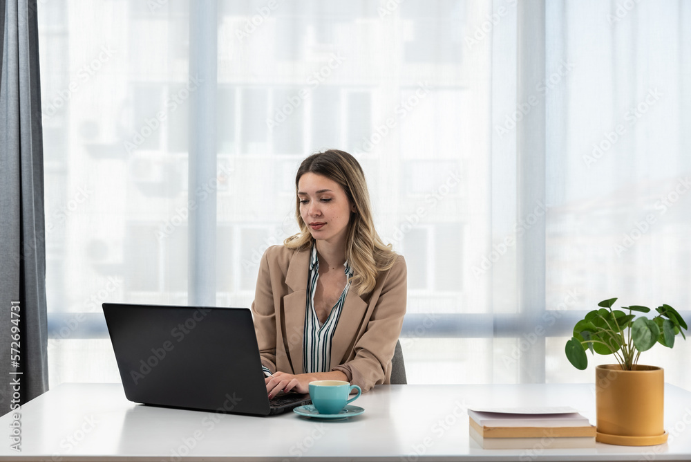 Young business woman office worker working on laptop computer report for superior about company's financial performance and profit, review of business for last quarter and ideas for successful year Young business woman office worker working on laptop computer report for superior about company's financial performance and profit, review of business for last quarter and ideas for successful year